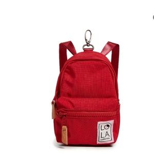 Lola California mini convertible backpack, cross body, sling, or belt clip.